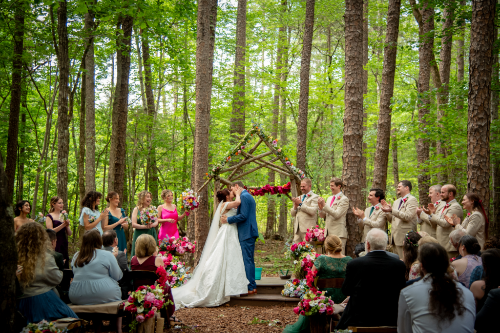 Daisy & Nathan's outdoor ceremony, surrounded by trees and their people.